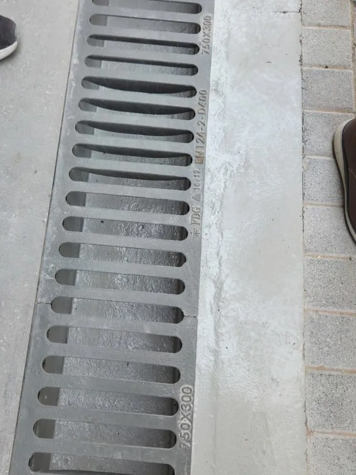 Ductile iron channel drainage grating installed in a paved run