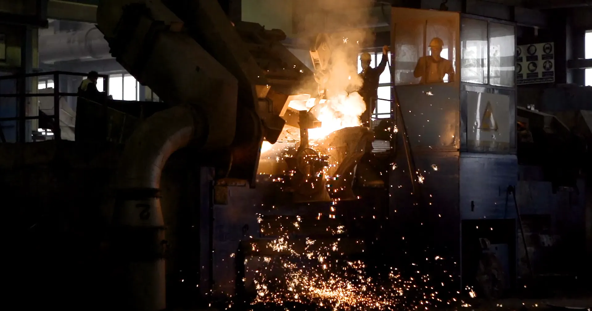 Furnace pour throwing sparks across the foundry floor