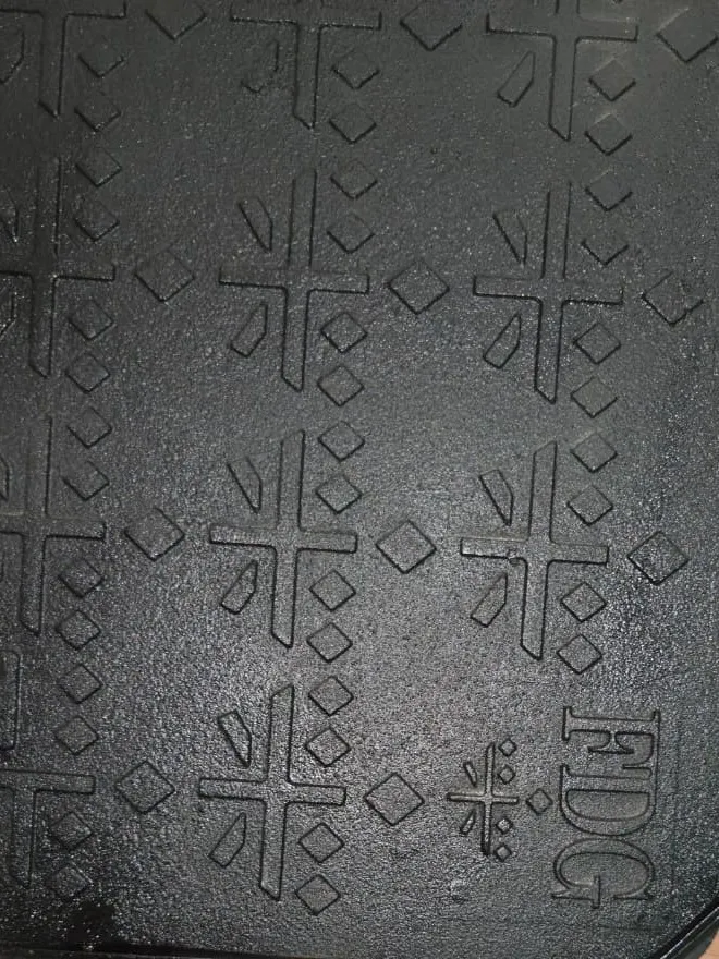 Close view of the cast face of an FDG ductile iron manhole cover